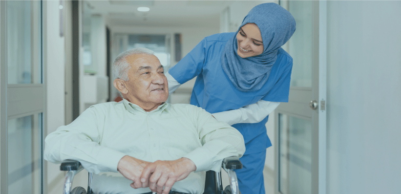 Nurse supporting man in wheelchair